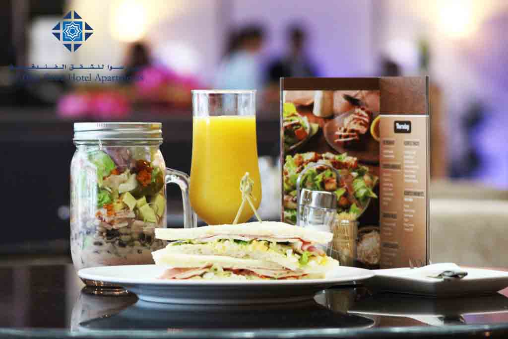 Salad, sandwich and  orange juice at Cafe Day to Day